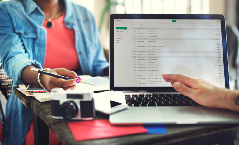 Man checking his laptop wondering how much does email marketing cost